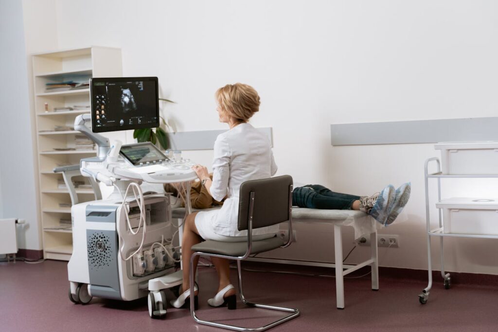 Doctor performing an abdominal scan